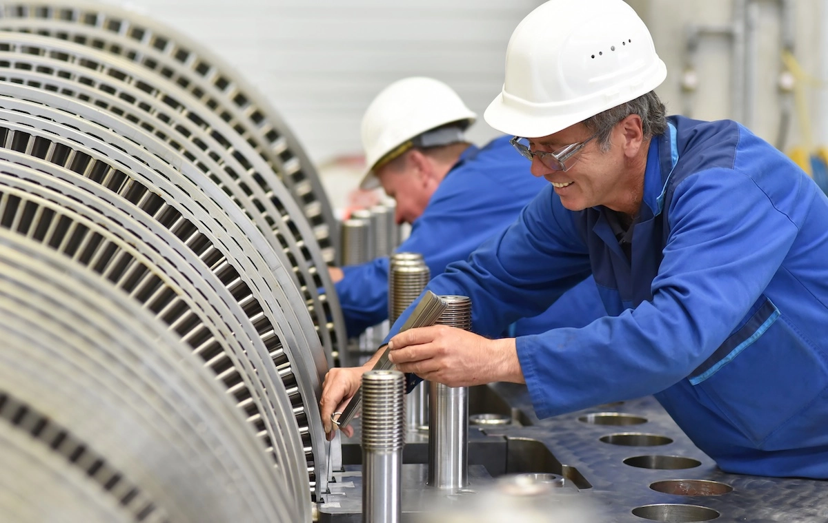 Workers testing the turbine with metal hardness testers